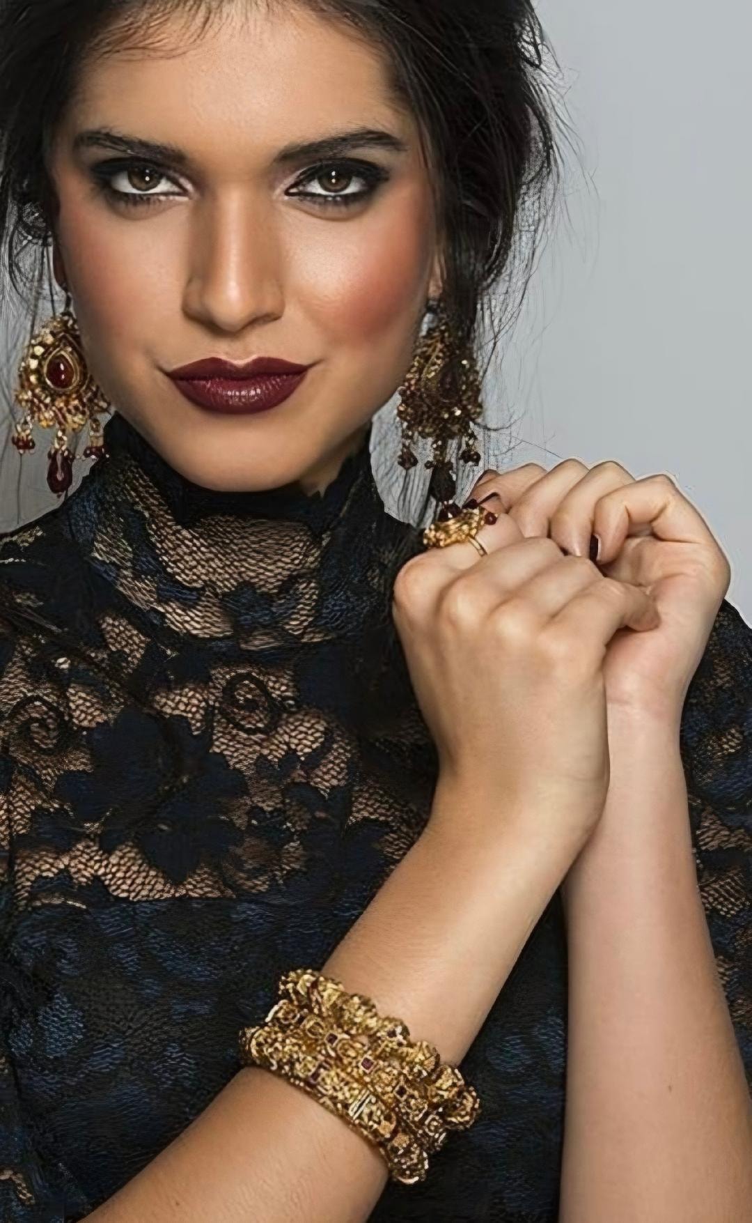 Glam editorial — dark berry lip, smoky eye, gold jewellery, black lace