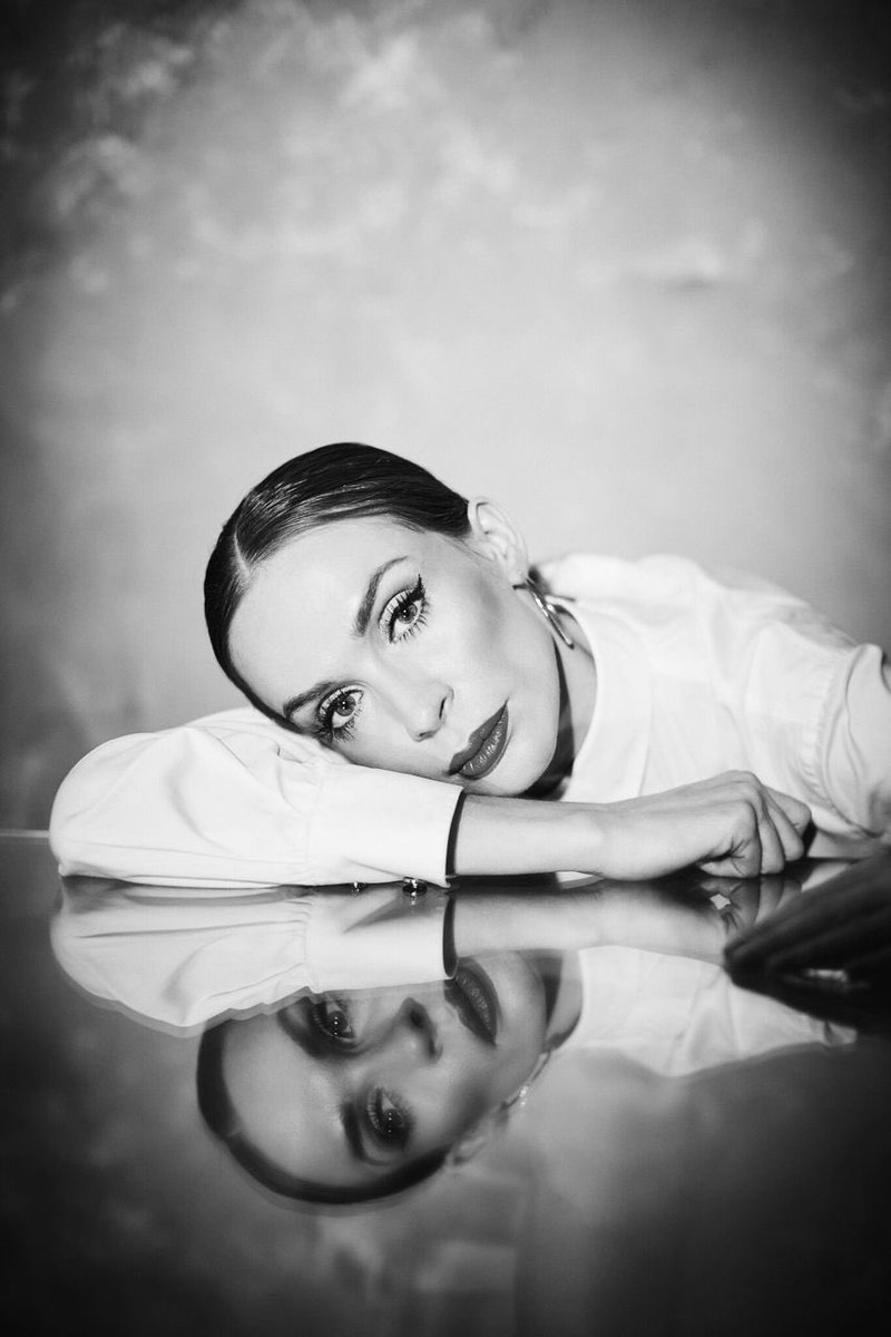 Black and white beauty — reflection portrait with dramatic lashes