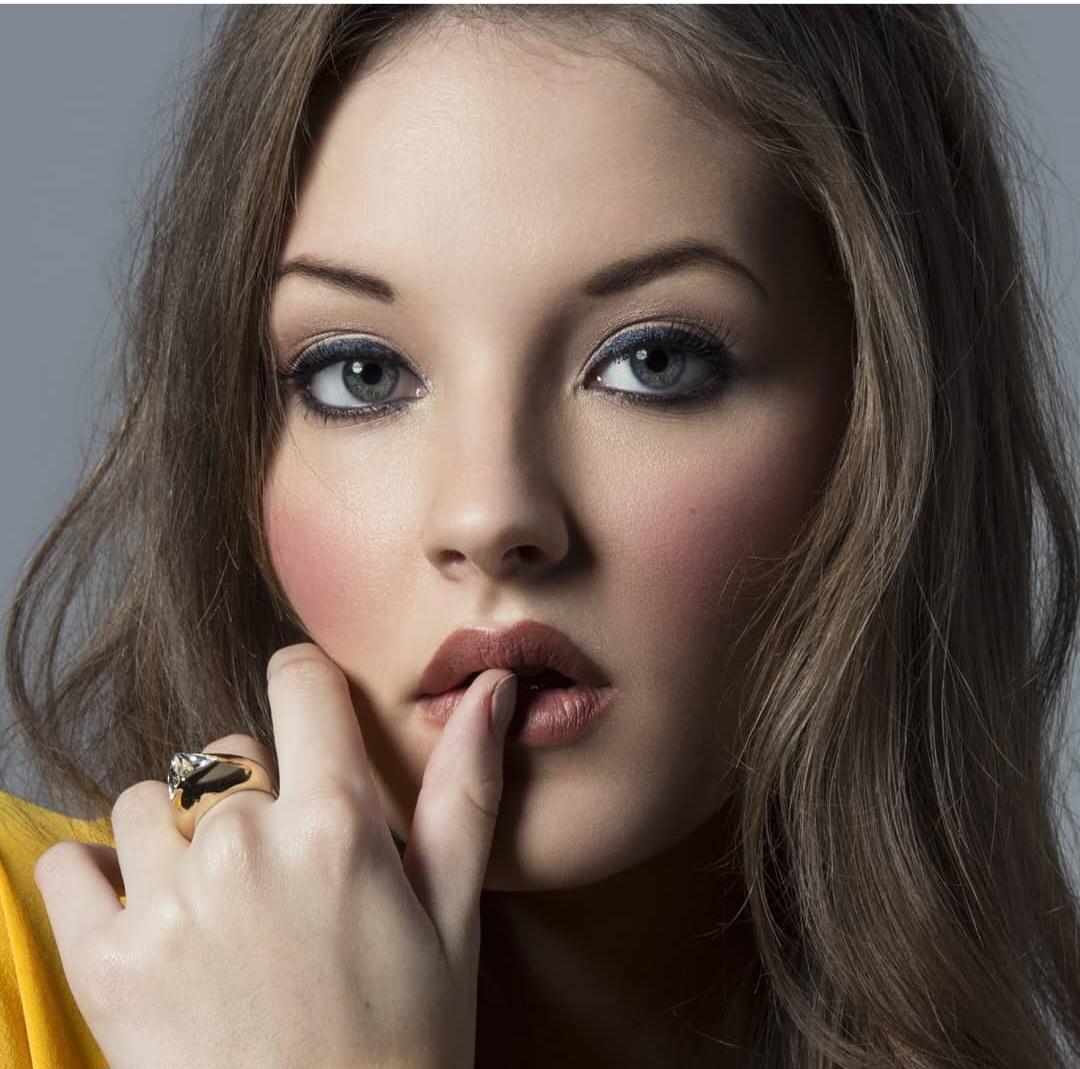 Beauty portrait — blue eyes, rosy cheeks, berry lip